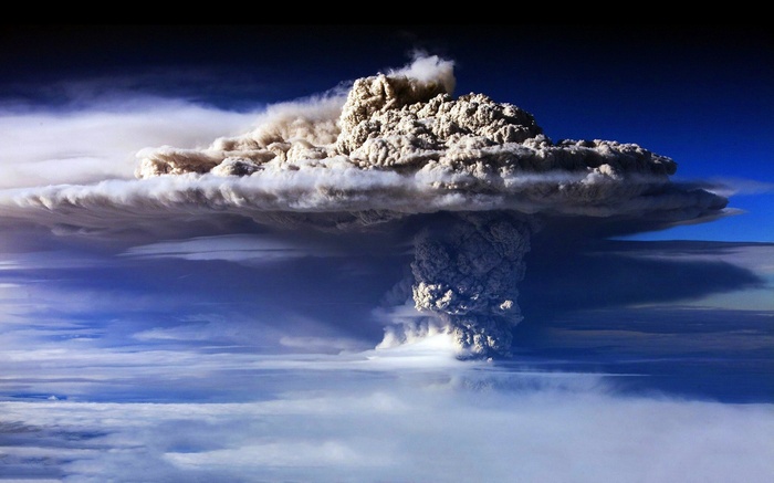 Massive volcanic ash cloud erupting into the sky