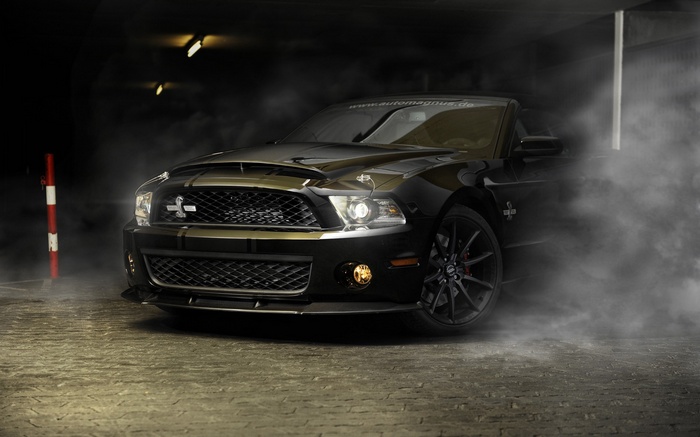 Black Ford Shelby GT500 with smoke
