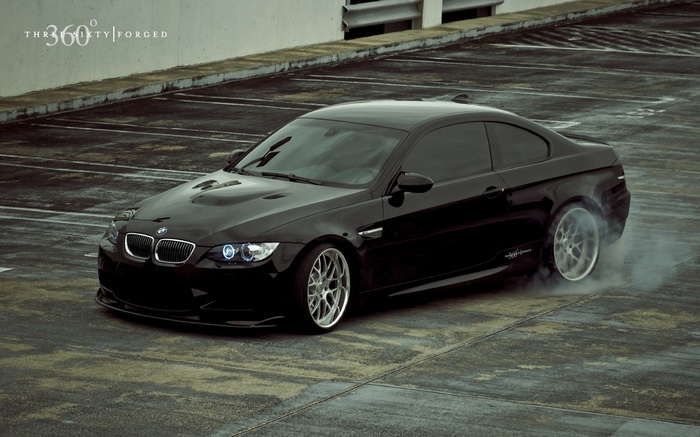 Black BMW M3 doing a burnout