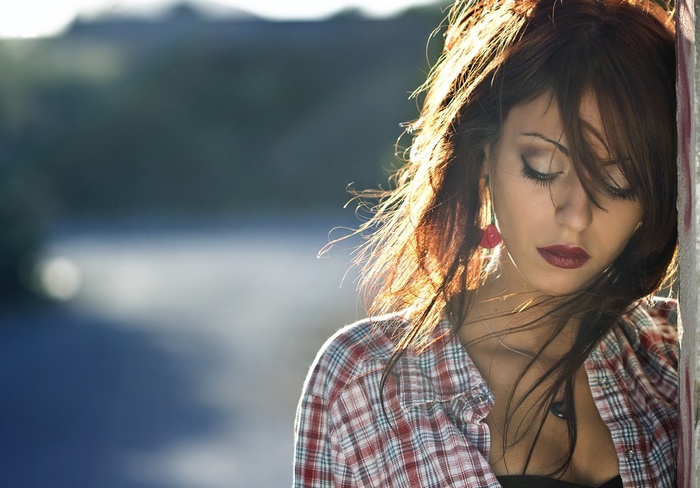 Woman with red lipstick and plaid shirt