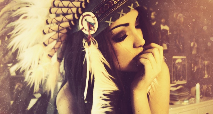 Woman wearing a Native American headdress