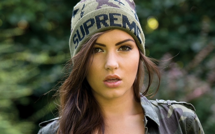 Sabine Jemeljanova wearing a Supreme beanie and camouflage jacket