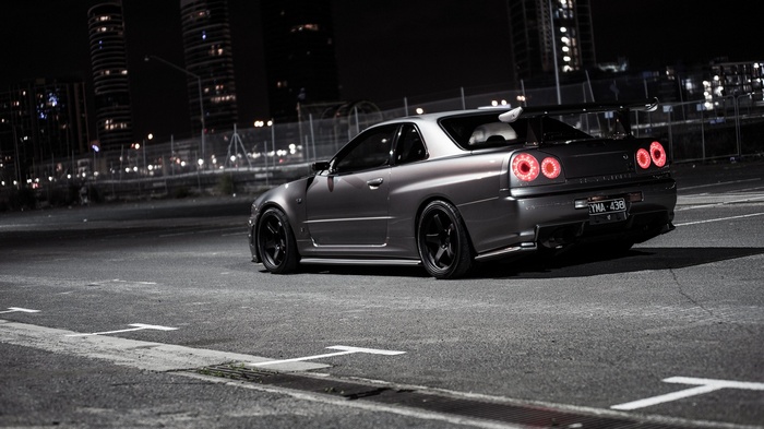 Nissan Skyline GT-R parked at night in a city