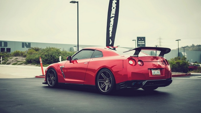 Red Nissan GTR with a large spoiler