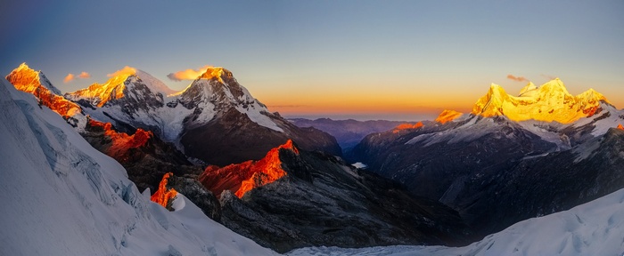 Sunrise over snow-capped mountains