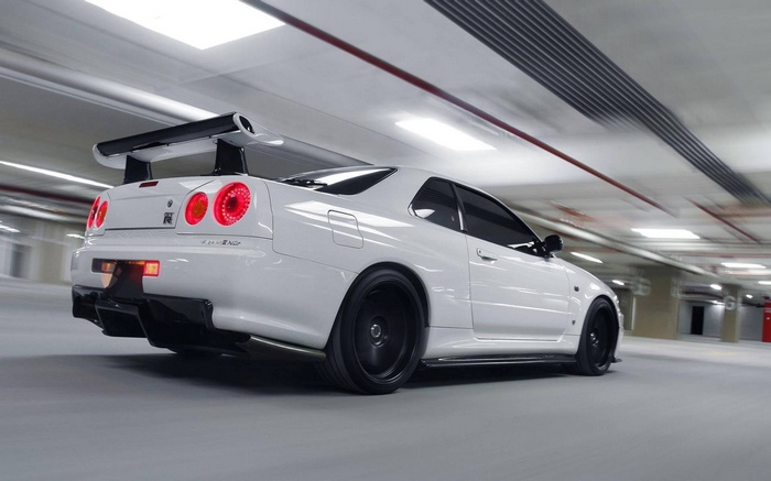 White Nissan Skyline GT-R R34 V-Spec II in parking garage