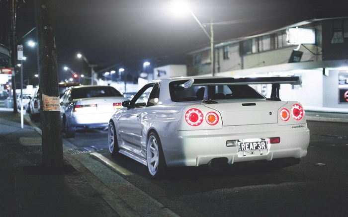 White Nissan Skyline GT-R R34 with large spoiler