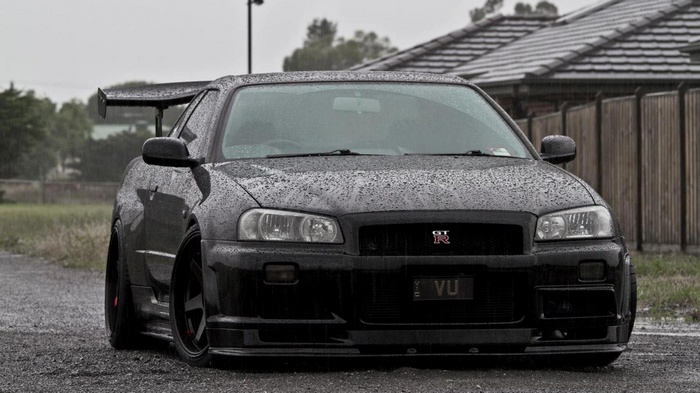 Black Nissan Skyline GT-R R34 in the rain