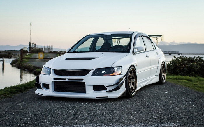 White Mitsubishi Lancer Evolution IX with a large spoiler