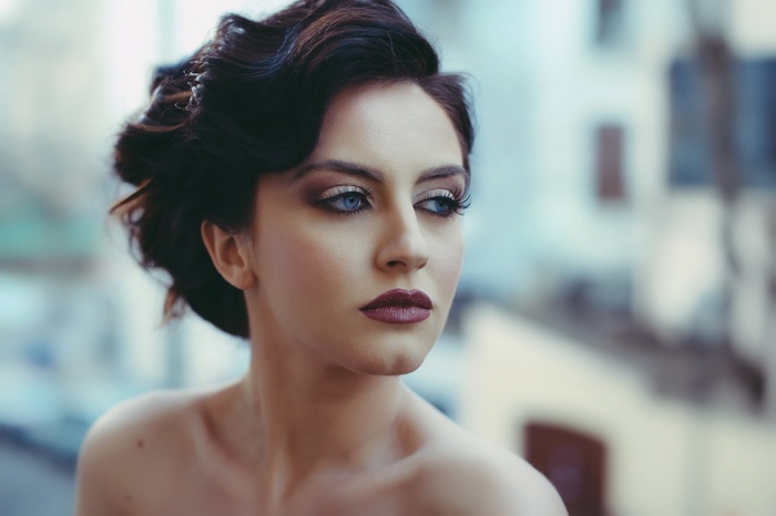 Aurela Skandaj with blue eyes and makeup
