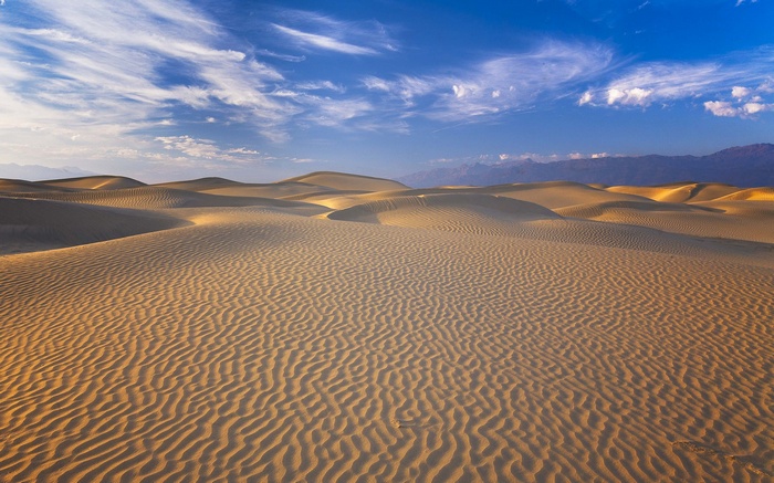 Death Valley sand dunes under a blue sky