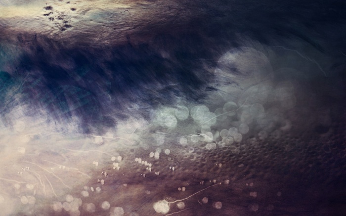 Abstract dark blue and purple textured background with bokeh