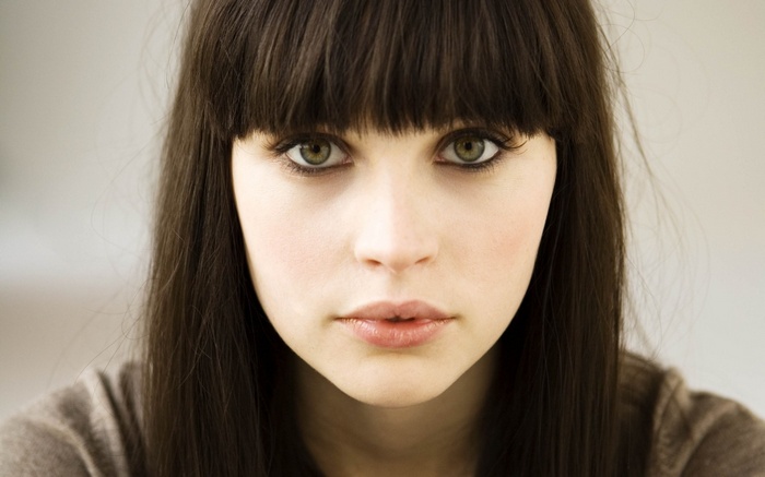 Felicity Jones with green eyes and bangs