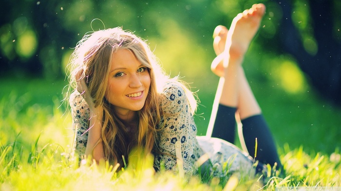 Diana Vickers lying in grass with legs up