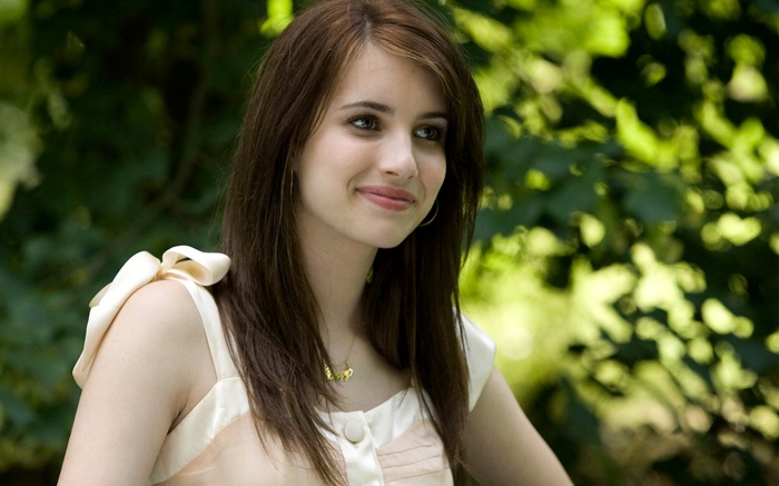 Emma Roberts smiling outdoors