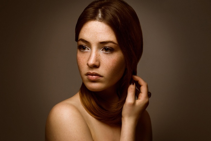 Woman with red hair and freckles