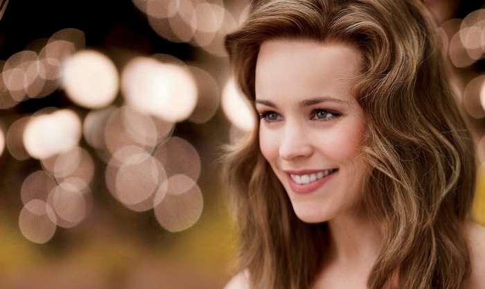 Rachel McAdams smiling with bokeh background