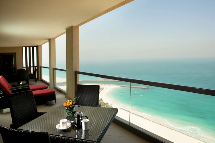 Balcony overlooking a tropical beach and turquoise sea
