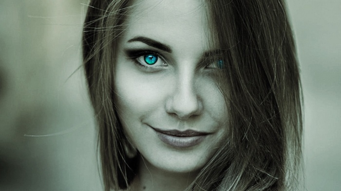 Woman with turquoise eyes and selective coloring