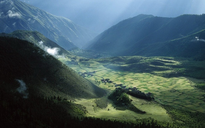 Valley landscape in Tibet with patchwork fields