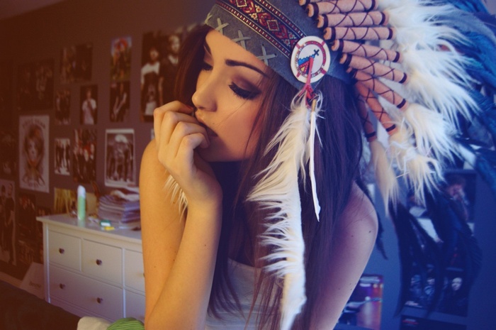 Woman wearing a Native American headdress