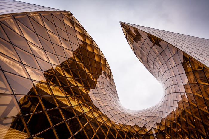 Emporia building with geometric glass facade and overcast sky