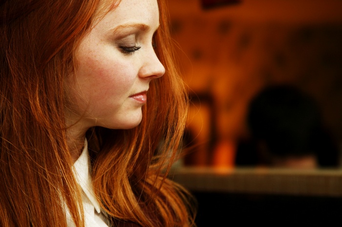 Lily Cole in profile with long red hair