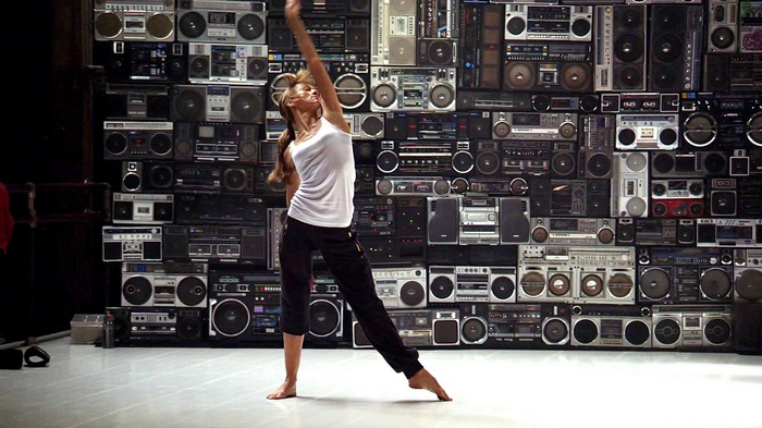 Step Up dancer in front of boombox wall