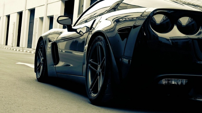 Black Corvette parked on a street