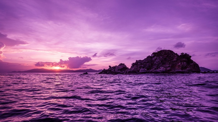 Purple sunset over the sea with Pelican Island