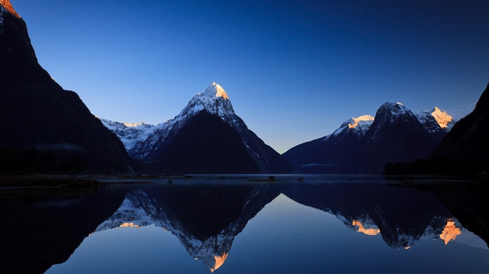 Milford Sound, New Zealand mountains at sunrise reflection
