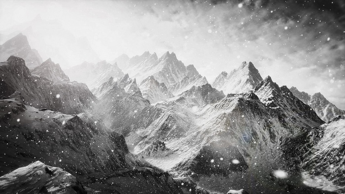 Snowy mountain landscape with falling snow