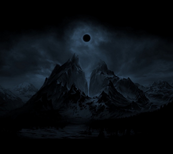 Dark mountains under an eclipse at night