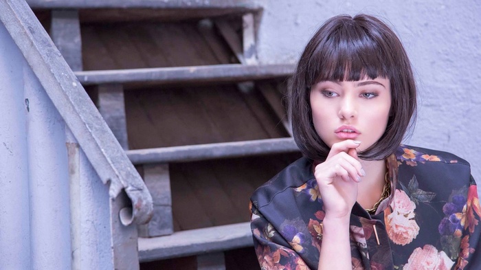 Marie Grippon with short hair on stairs