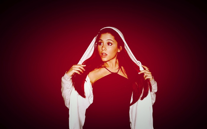 Ariana Grande wearing a hoodie and black top