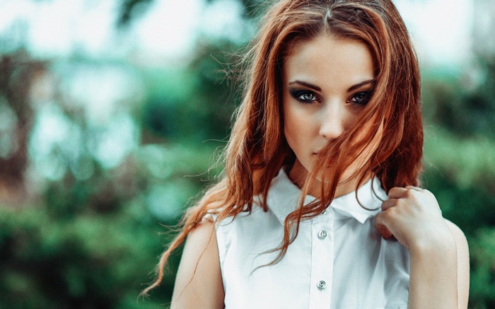 Alla Berger with long red hair and blue eyes