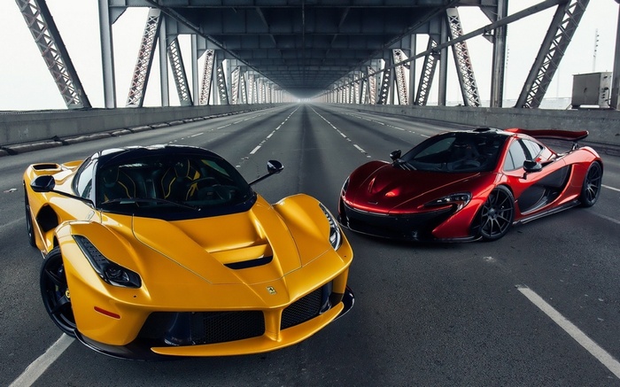 Ferrari LaFerrari and McLaren P1 on a bridge
