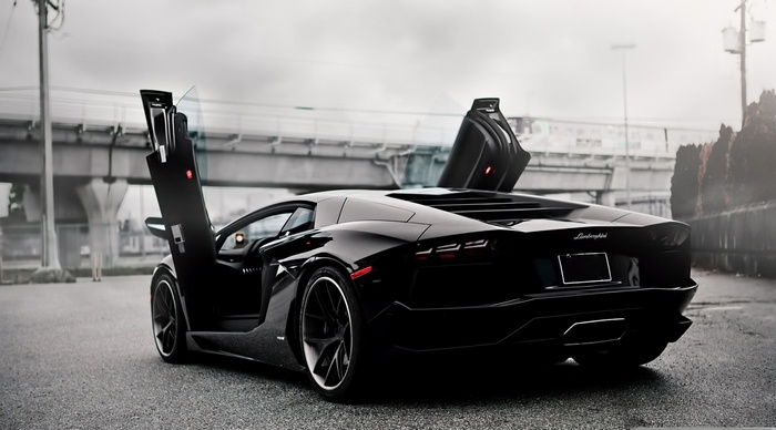 Black Lamborghini Aventador with doors open