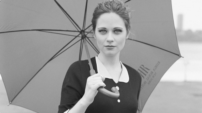 Zooey Deschanel holding an umbrella