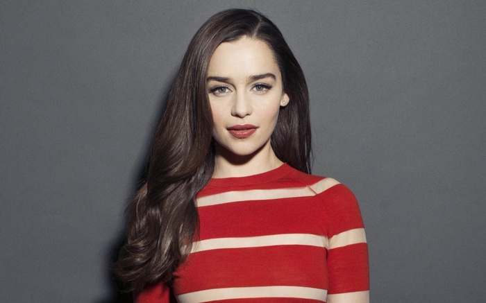 Emilia Clarke wearing a red and white striped shirt