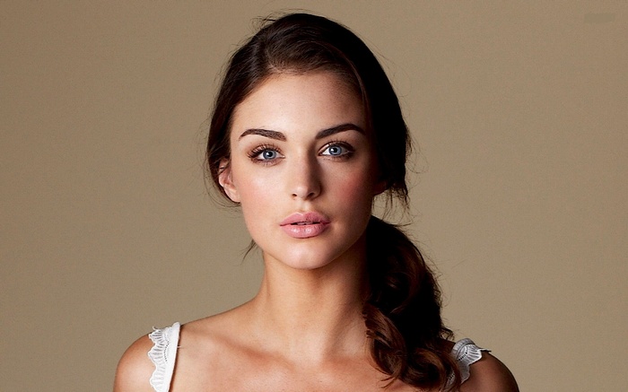 Lauren Budd with blue eyes and brunette hair