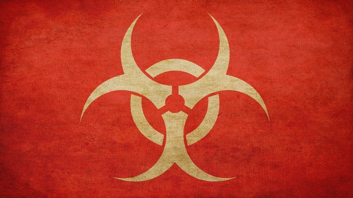 Biohazard symbol on a red textured background
