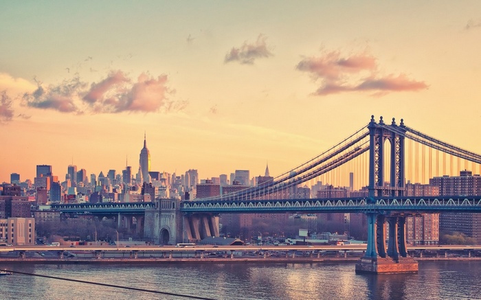 New York City skyline with Manhattan Bridge at sunset