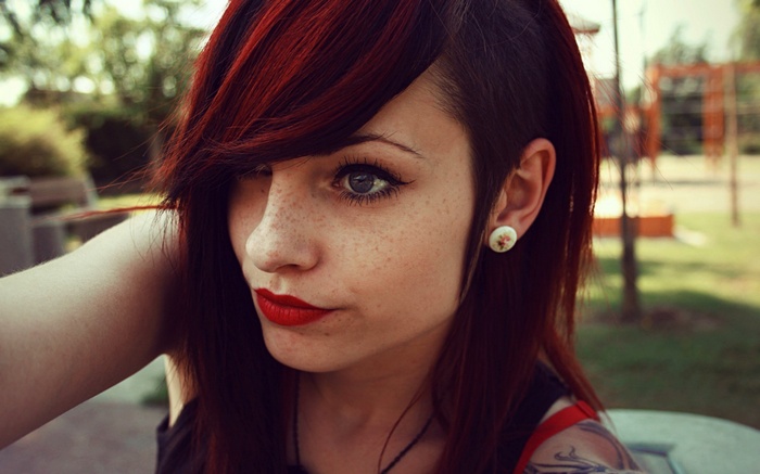 Woman with red hair and freckles