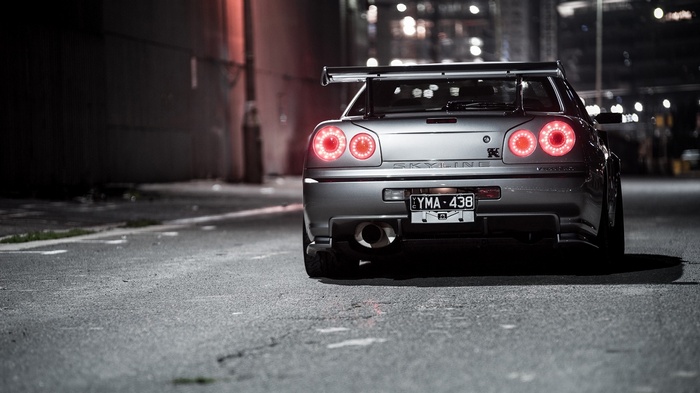 Nissan Skyline GT-R R34 rear view at night