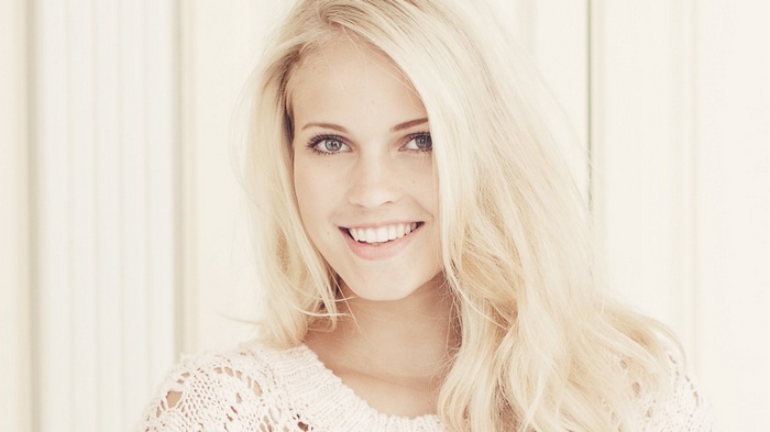 Emilie Marie Nereng smiling in a white sweater