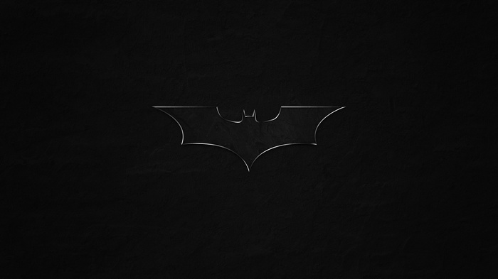The Batman logo on a dark background