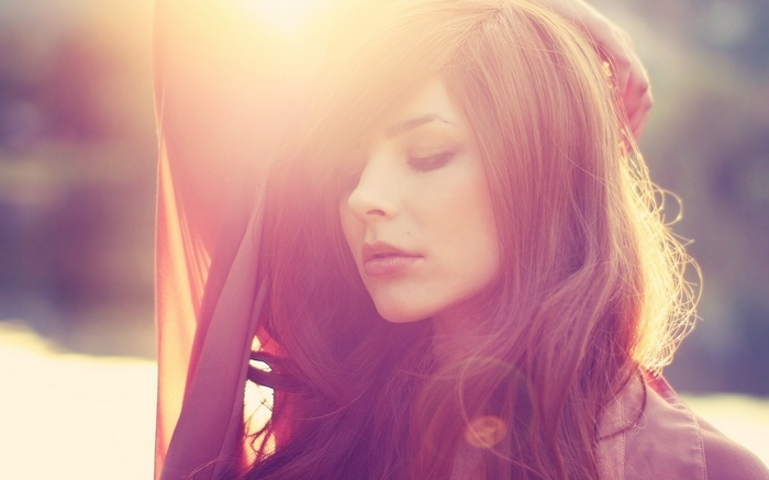 Woman with sunlight filtering through her hair