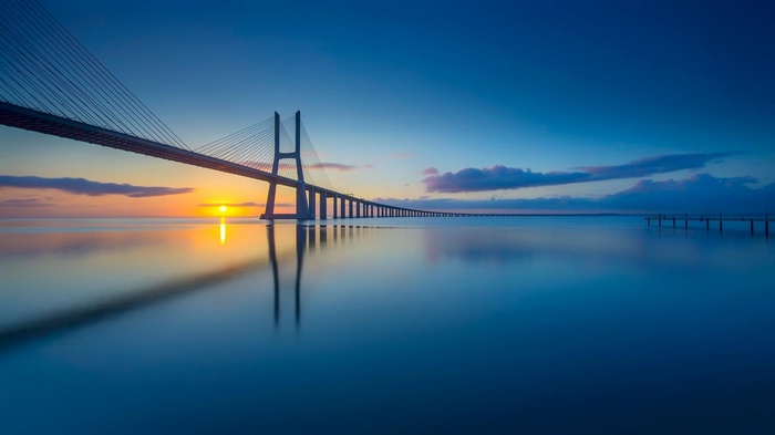 Vasco da Gama Bridge over the Tagus River at sunrise