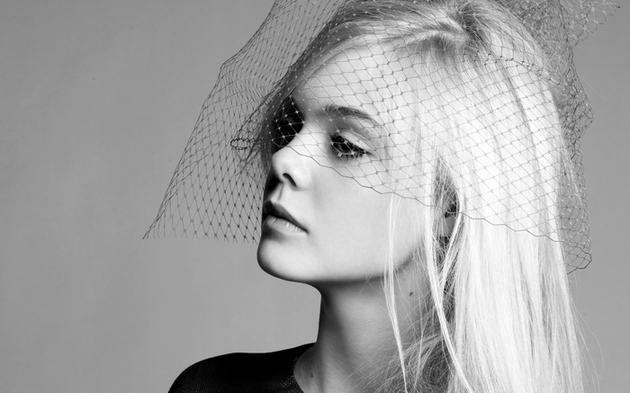 Elle Fanning wearing a veil in a monochrome portrait